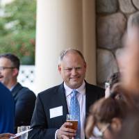 Tim talking to guests